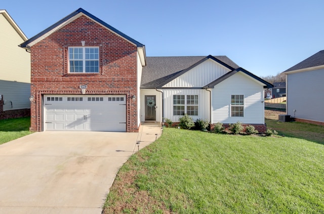 view of property featuring central AC, a garage, and a front lawn