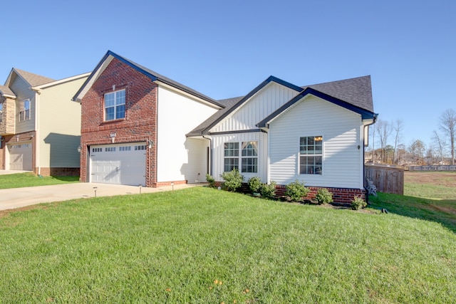 view of front of home with a front yard and a garage