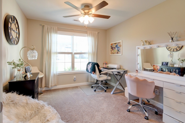 carpeted office featuring ceiling fan