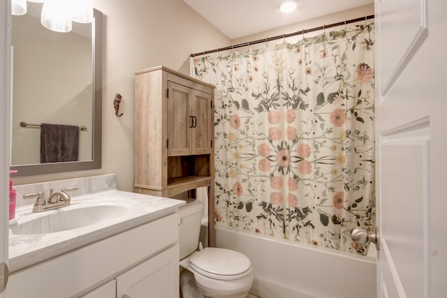 full bathroom featuring shower / bath combination with curtain, toilet, and vanity