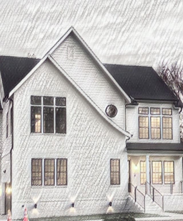 rear view of house with covered porch