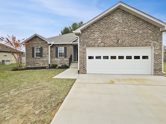 view of front of home featuring a garage and a front lawn