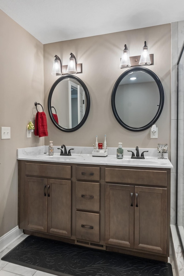 bathroom with tile patterned flooring and vanity