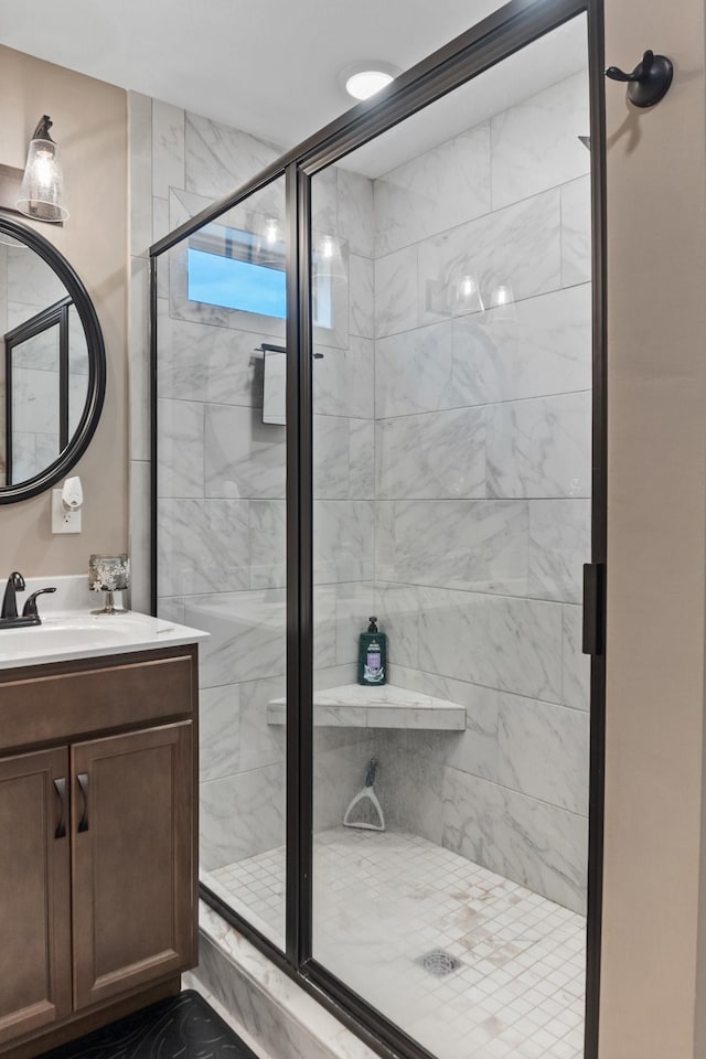 bathroom with vanity and an enclosed shower