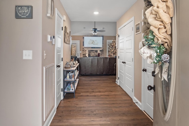 corridor featuring dark hardwood / wood-style floors