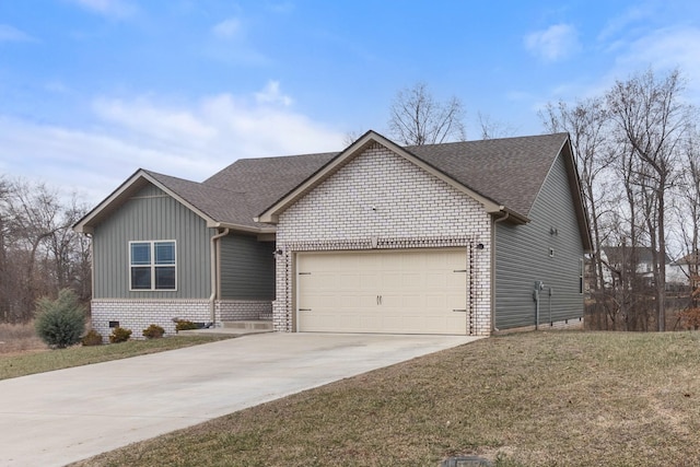 view of front of property featuring a garage and a front lawn