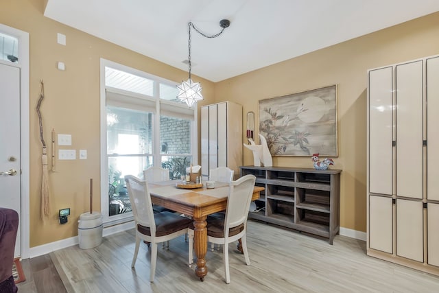 dining room with light wood-type flooring