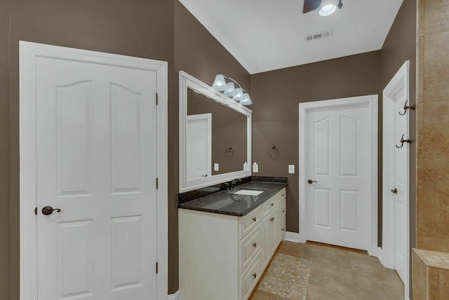 bathroom featuring ceiling fan, tile patterned flooring, and vanity