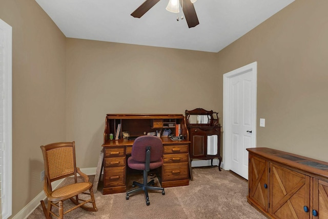 home office featuring light colored carpet and ceiling fan