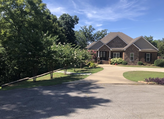 craftsman-style house with a front yard