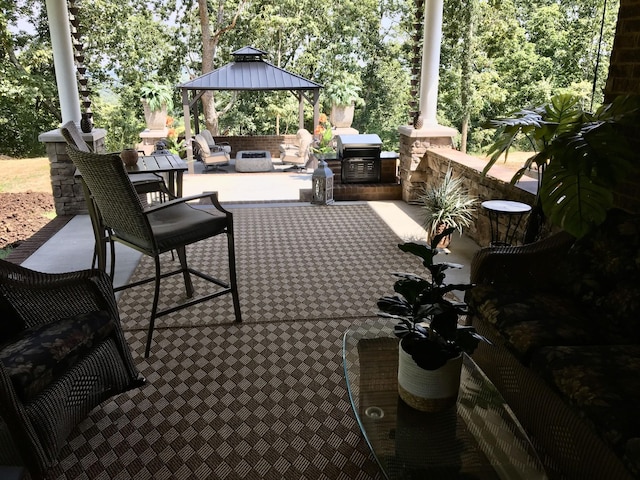 view of patio / terrace featuring outdoor lounge area, a gazebo, and a grill