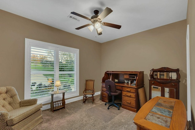 carpeted office with ceiling fan