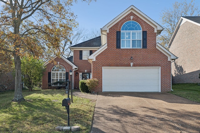 front facade with a front yard and a garage