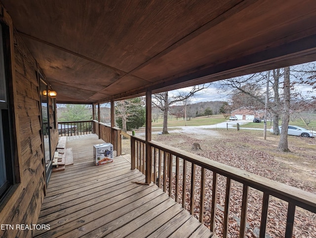 wooden terrace featuring a porch