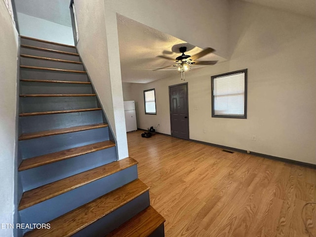 interior space with ceiling fan and light wood-type flooring