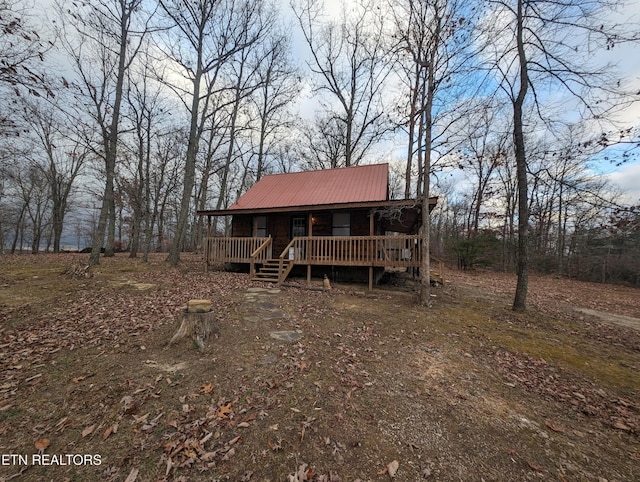 view of front facade with a wooden deck