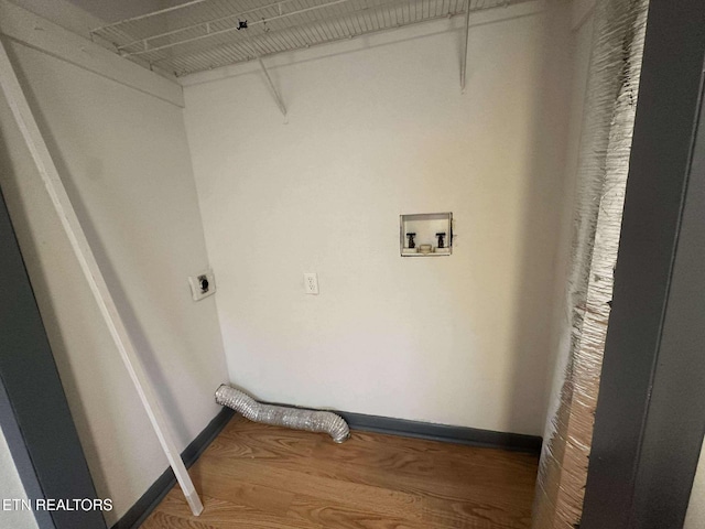 laundry room featuring hookup for an electric dryer, hardwood / wood-style floors, and hookup for a washing machine