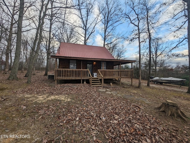 view of front of property featuring a wooden deck