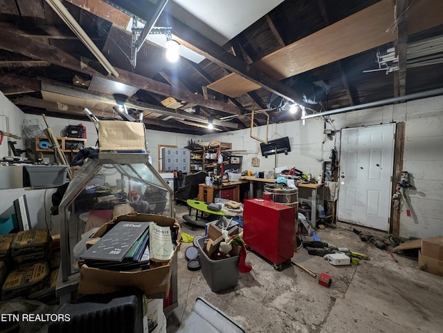 misc room featuring a workshop area and concrete flooring