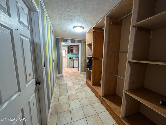 spacious closet featuring light tile patterned floors