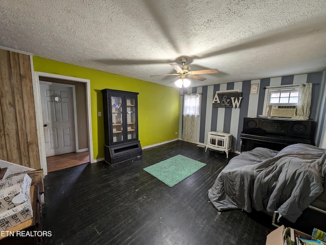 bedroom featuring a textured ceiling, ceiling fan, cooling unit, and dark wood-type flooring