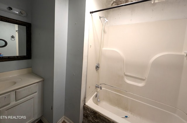 bathroom featuring shower / tub combination and vanity