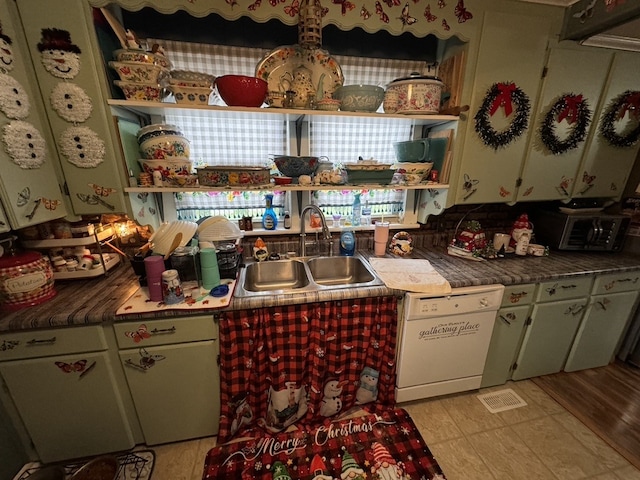 kitchen with dishwasher, light wood-type flooring, and sink