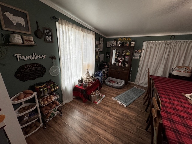 interior space with hardwood / wood-style floors and ornamental molding