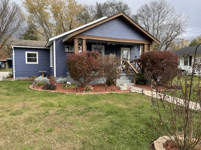 view of front facade with a front lawn and covered porch