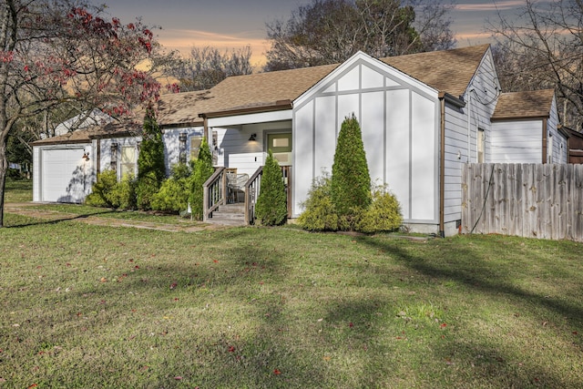 outdoor structure at dusk with a yard