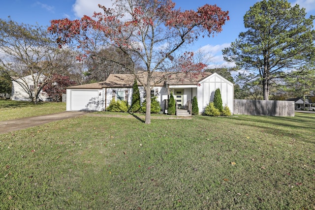 view of front of home with a front lawn and a garage