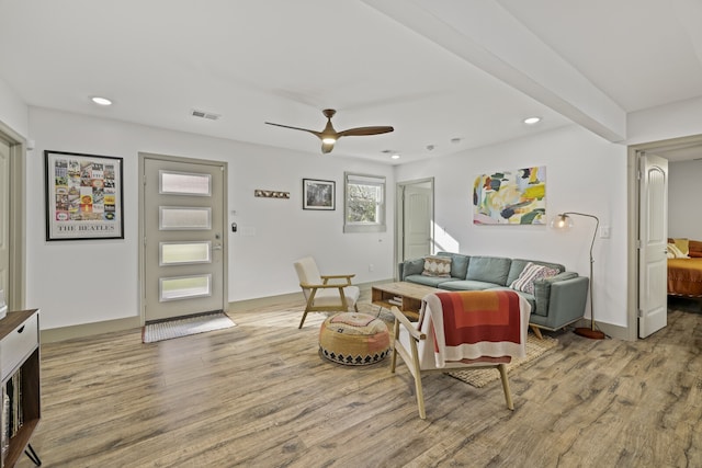 living room with ceiling fan and hardwood / wood-style floors