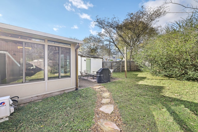 view of yard featuring a sunroom