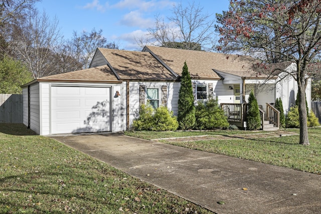 view of front of house featuring a front lawn and a garage