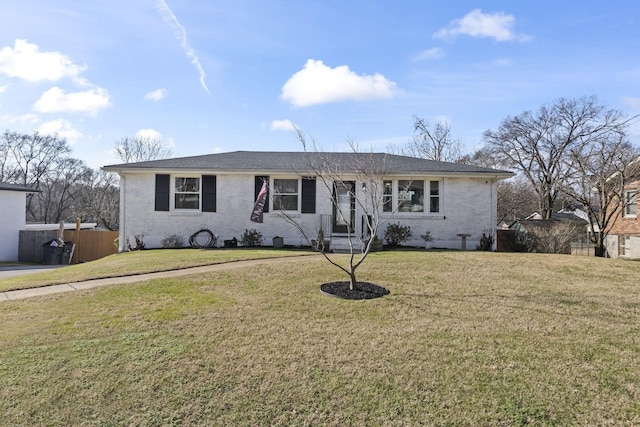 single story home with a front yard