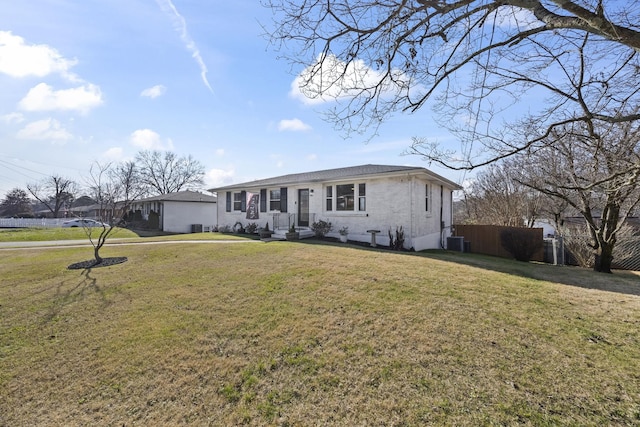 ranch-style home with cooling unit and a front yard