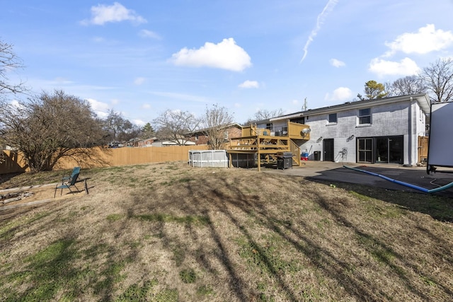 view of yard with a swimming pool side deck