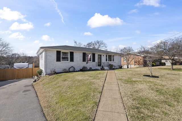 single story home featuring a front yard