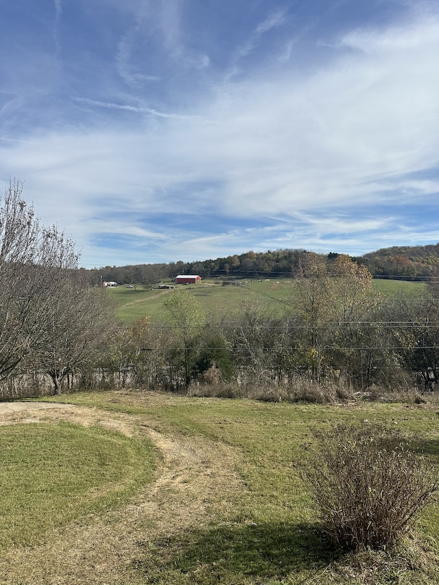 mountain view featuring a rural view