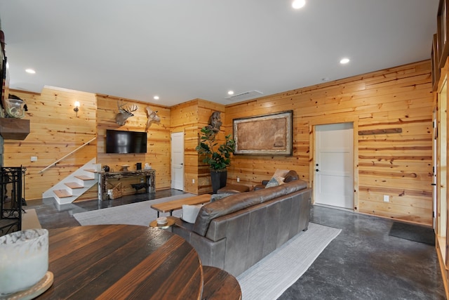 living room featuring wood walls