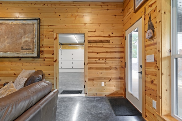 entryway with wooden walls