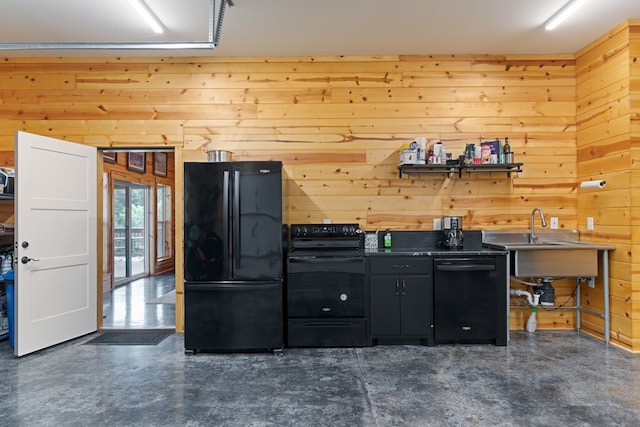 kitchen with sink, wooden walls, and black appliances