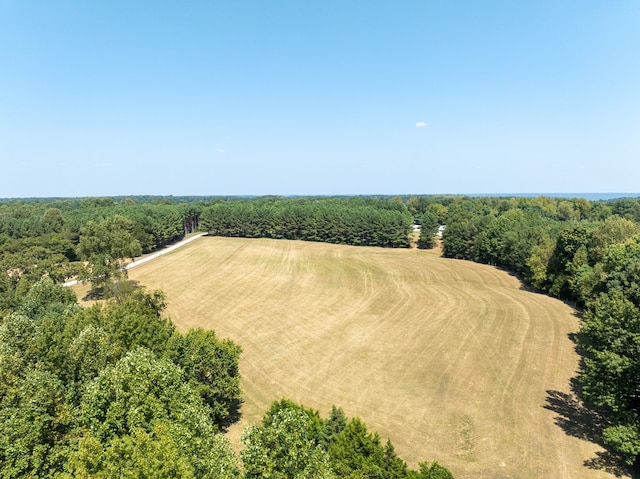 birds eye view of property with a rural view