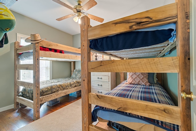 bedroom featuring ceiling fan and dark wood-type flooring