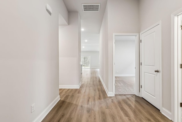 hallway with light wood-type flooring