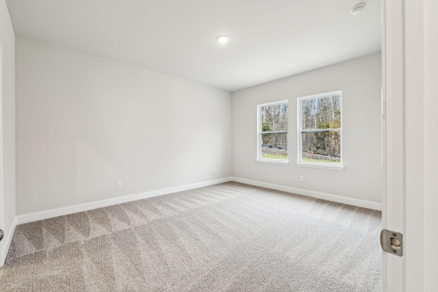 empty room featuring light colored carpet