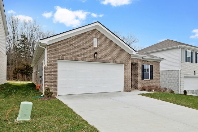 view of front of house with a front yard and a garage