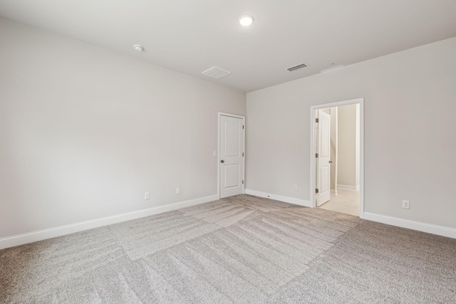 empty room with light colored carpet