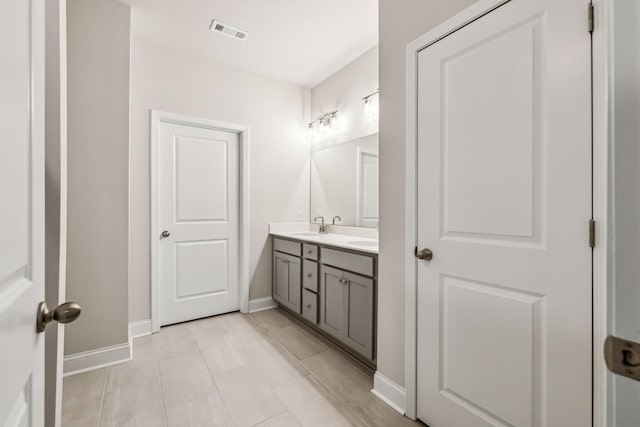 bathroom with vanity and tile patterned floors