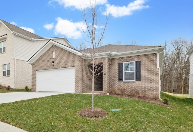 view of front of home with a front lawn and a garage